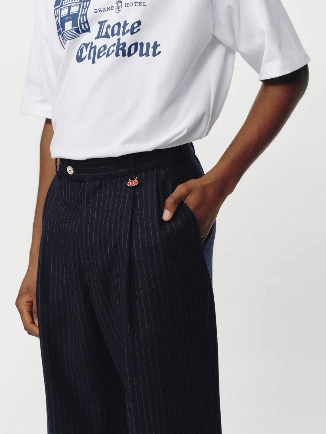 Late Checkout Navy Pinstripe Double Pleat Trousers | thegoodlife. UAE